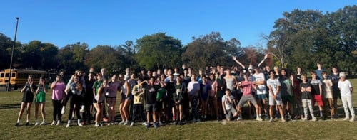 Large group of students outside for a cross country practice